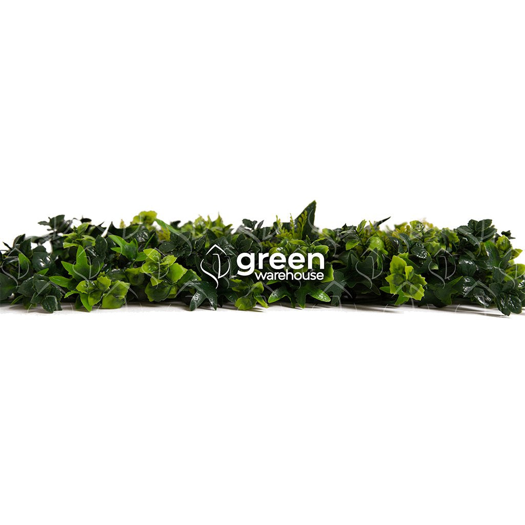 The Mixed Fern Artificial Foliage Panel is made up of three different ferns with textured leaves, varying in size and shades of green.