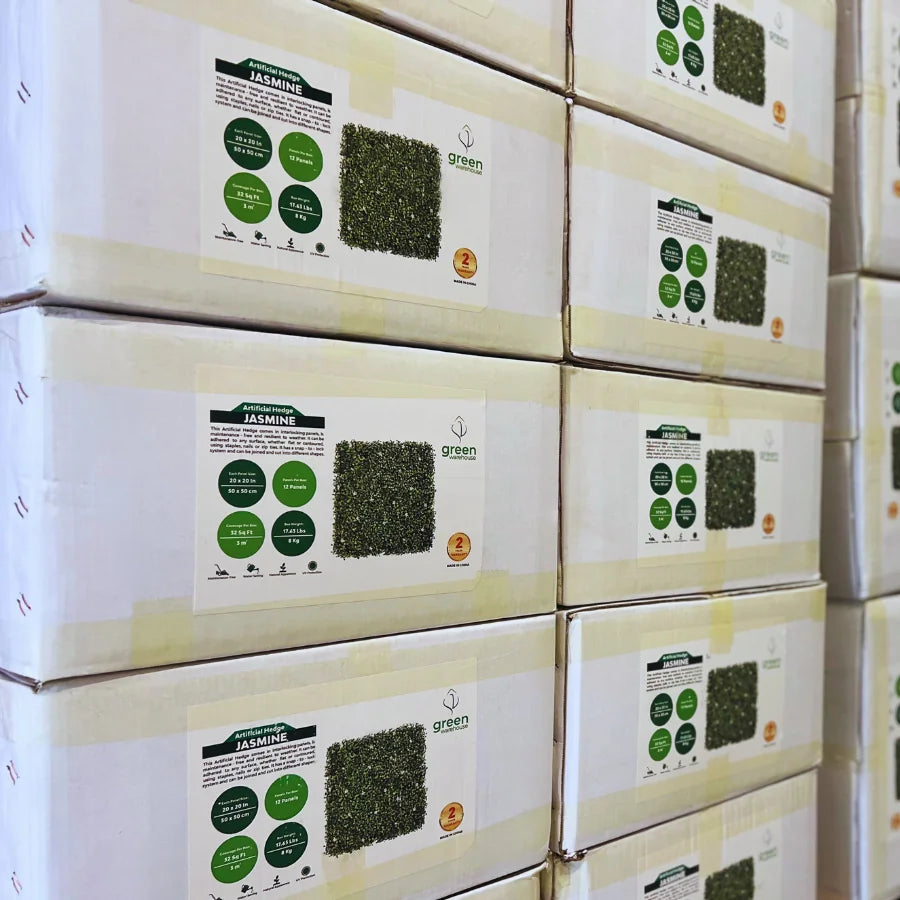 Wholesale boxes of Jasmine artificial hedge panels stacked for distribution. Green Warehouse USA offers high-quality artificial green wall panels for retailers and distributors