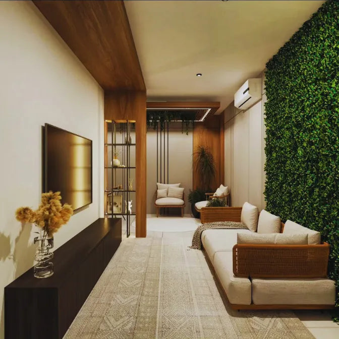Modern living room with artificial green accent wall beside sofa and wooden decor creating stylish indoor greenery design