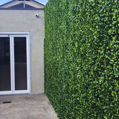 Gardenia Leaf Artificial Hedge Panel 40"x40" by Green Warehouse, glossy green foliage wall for outdoor privacy, patios, and modern decor.